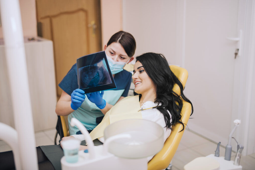 Dentist placing a dental implant for a patient in Anantapur clinic