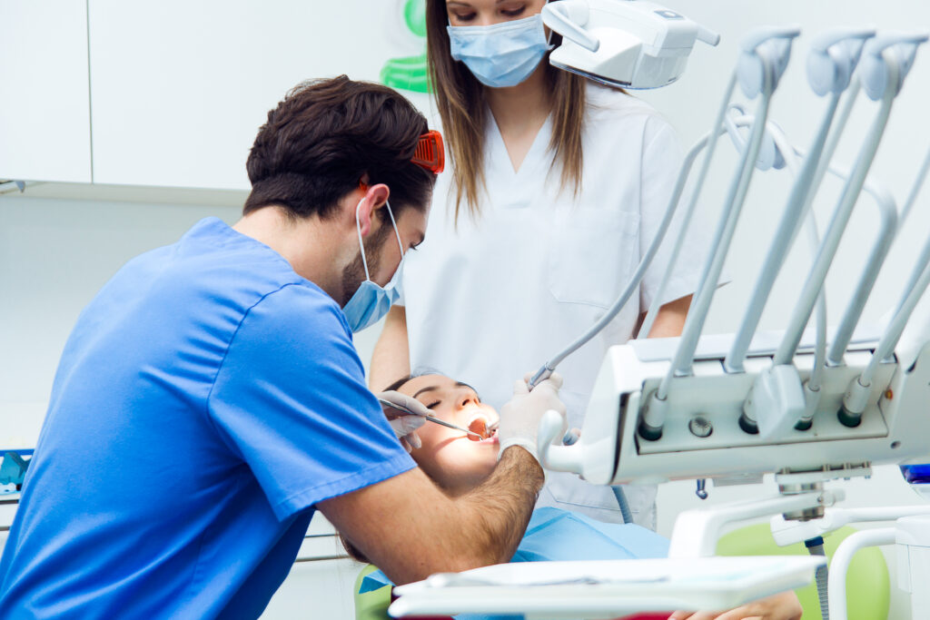 cute young woman at the dentist. mouth checkup